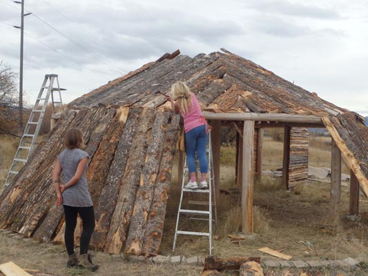 Constructing earthlodge walls.