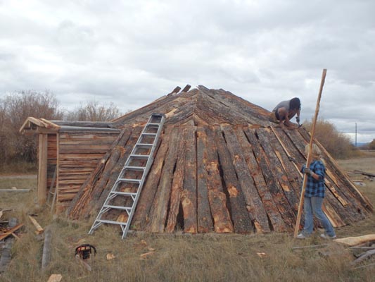 Earthlodge framework and slabwood cover complete.