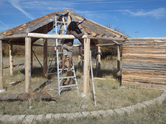 Earthlodge construction: building the roof.