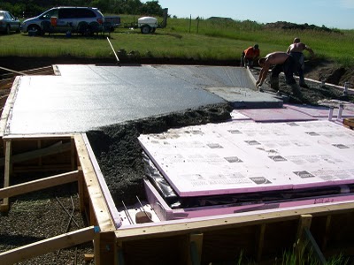 Pouring concrete slab.