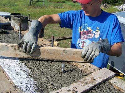 Screeding top of wall leaving exposed rod for sill plate.