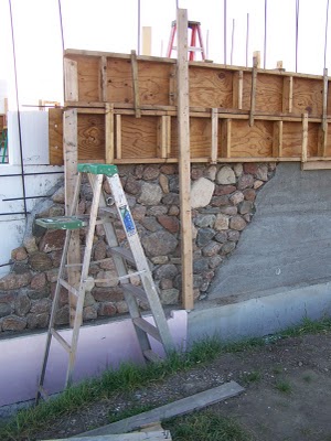 Slipform stone masonry wall.