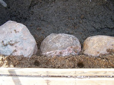 Slipform stone masonry close-up with sand method.