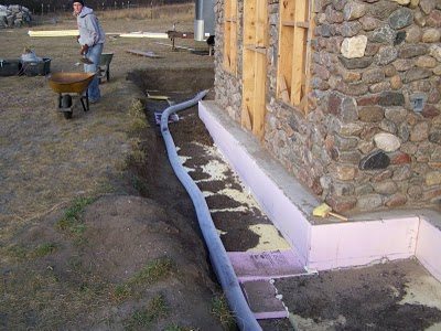 Backfilling along footing.