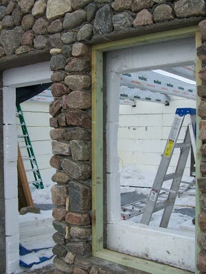 Window frames in stone wall.