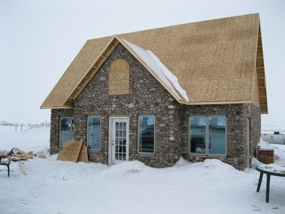 Prairie Stone Home with windows and doors installed.