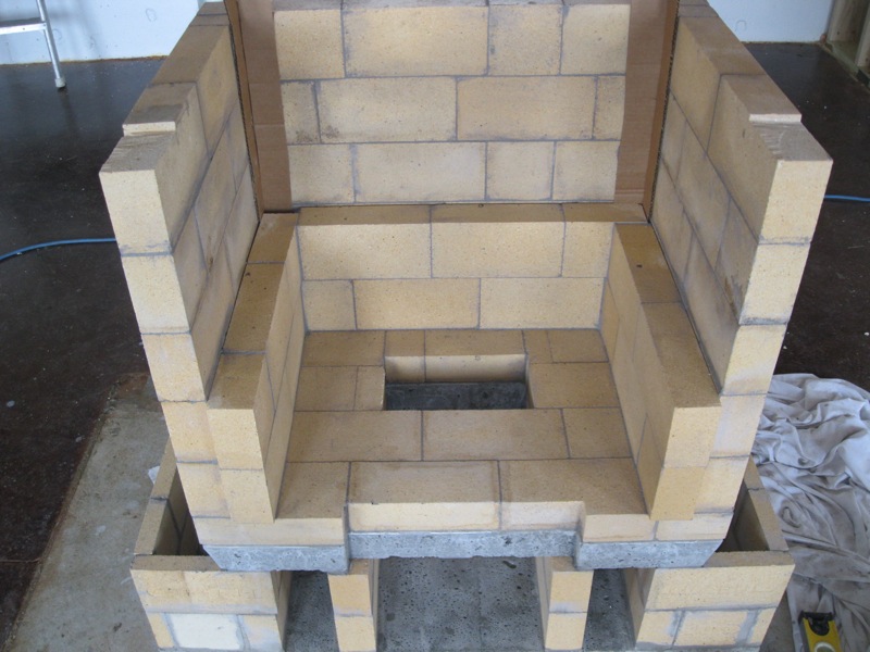 Constructing the walls of a Finnish masonry heater.