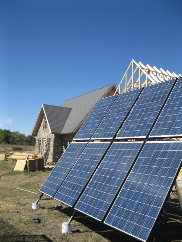 Photovoltaic panels for an off-grid stone home.