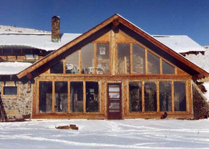 Passive solar greenhouse warms house in winter.