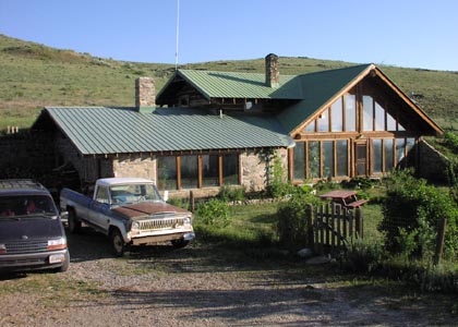 Finished stone and log home.