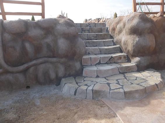 Stone steps and tire bale walls.