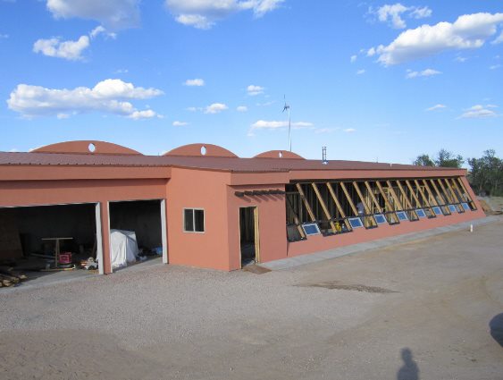 The completed roof and stucco work.