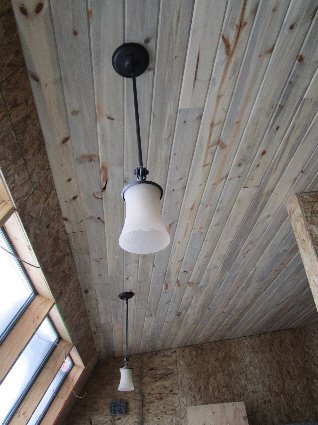 Tongue and groove ceilings give the house a rich, warm feeling.