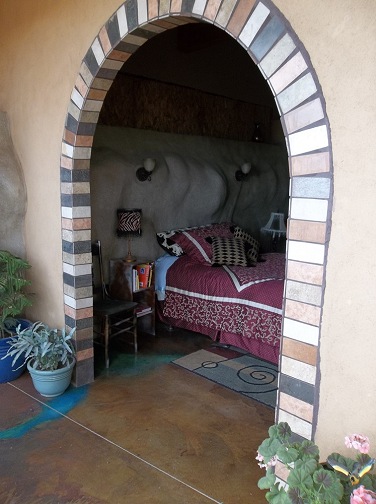 Arched entryway to the guest bedroom.