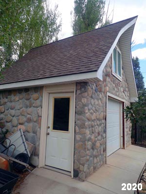 Slipform stone masonry shed.