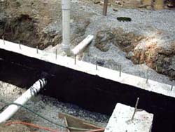 Rehl House: Foundation wall with sewer pipe.