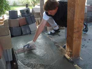 Troweling footing concrete.