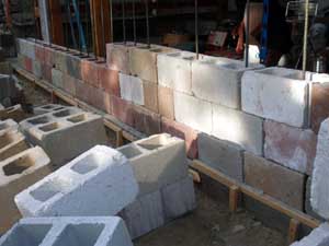 Dry stacked cinderblock for rebar and concrete poured cores.