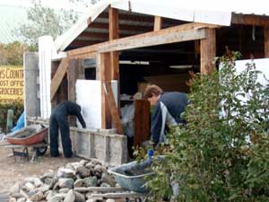 Slipform stone masonry front of garage.