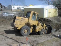 Excavating the building site.