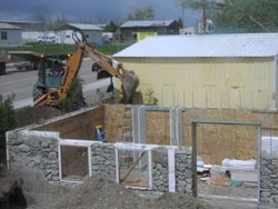 Backfilling around foundation.