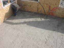 Leveling the floor with sand.