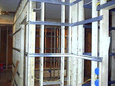 Interior wood framing with metal ties.