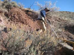 Collecting soil for making a terra tile floor.