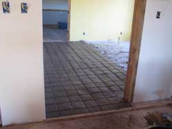 Terra tile floor with wet mortar.