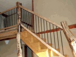 Stairway with log posts and railings.