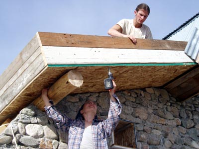 Constructing a roof from recycled materials.